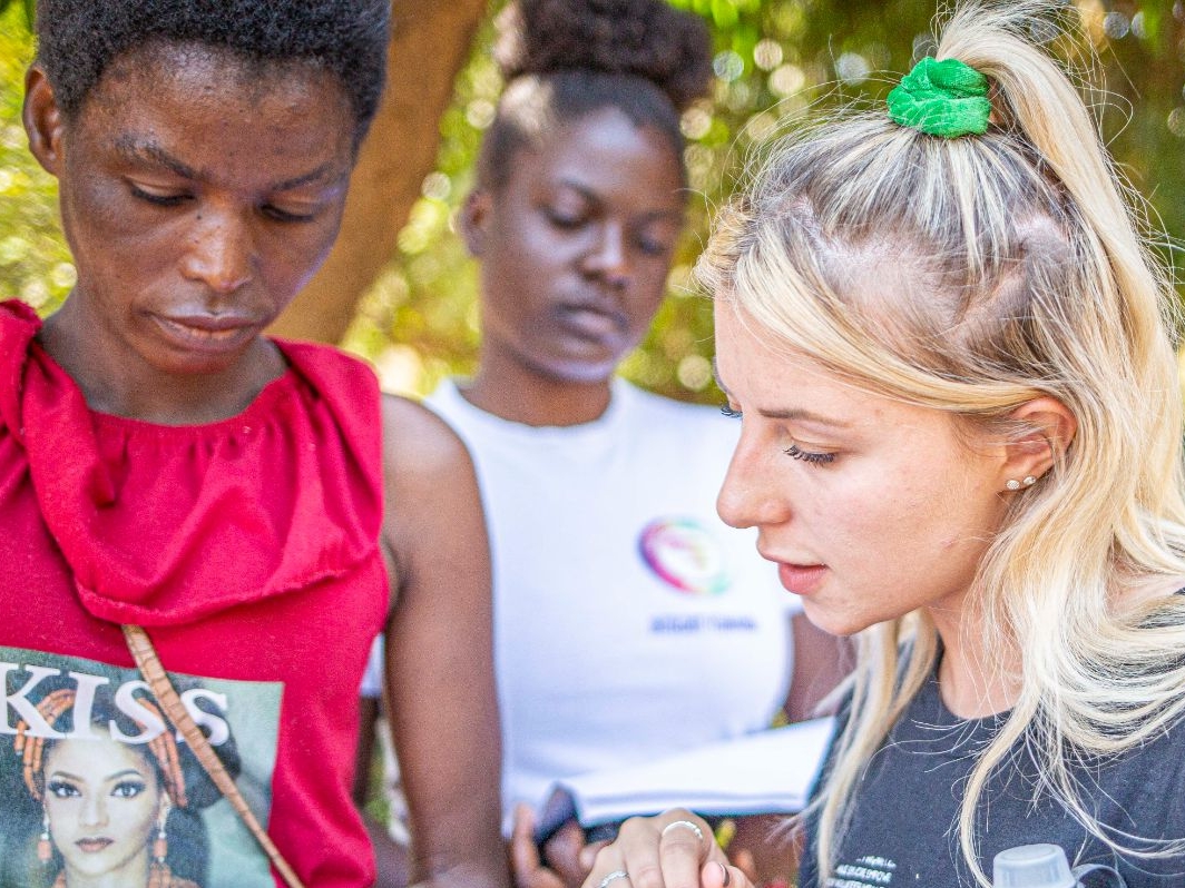 A man is holding a checklist pad and a woman is looking at it and checking the contents.