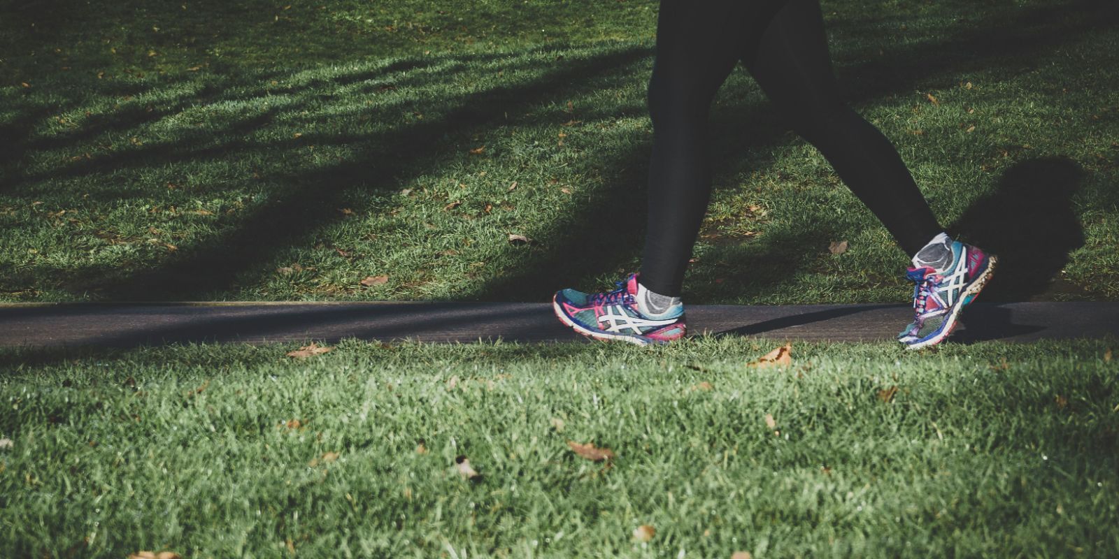 a woman walking on grass