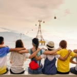 People sitting on a wall, showing how to make friends.