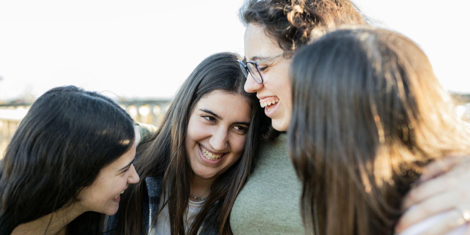 A group of young women standing next to each other.