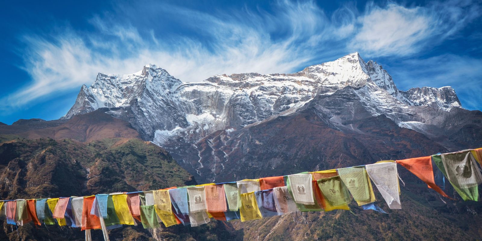 Prayer flags with snowy Himalayan peaks in Nepal